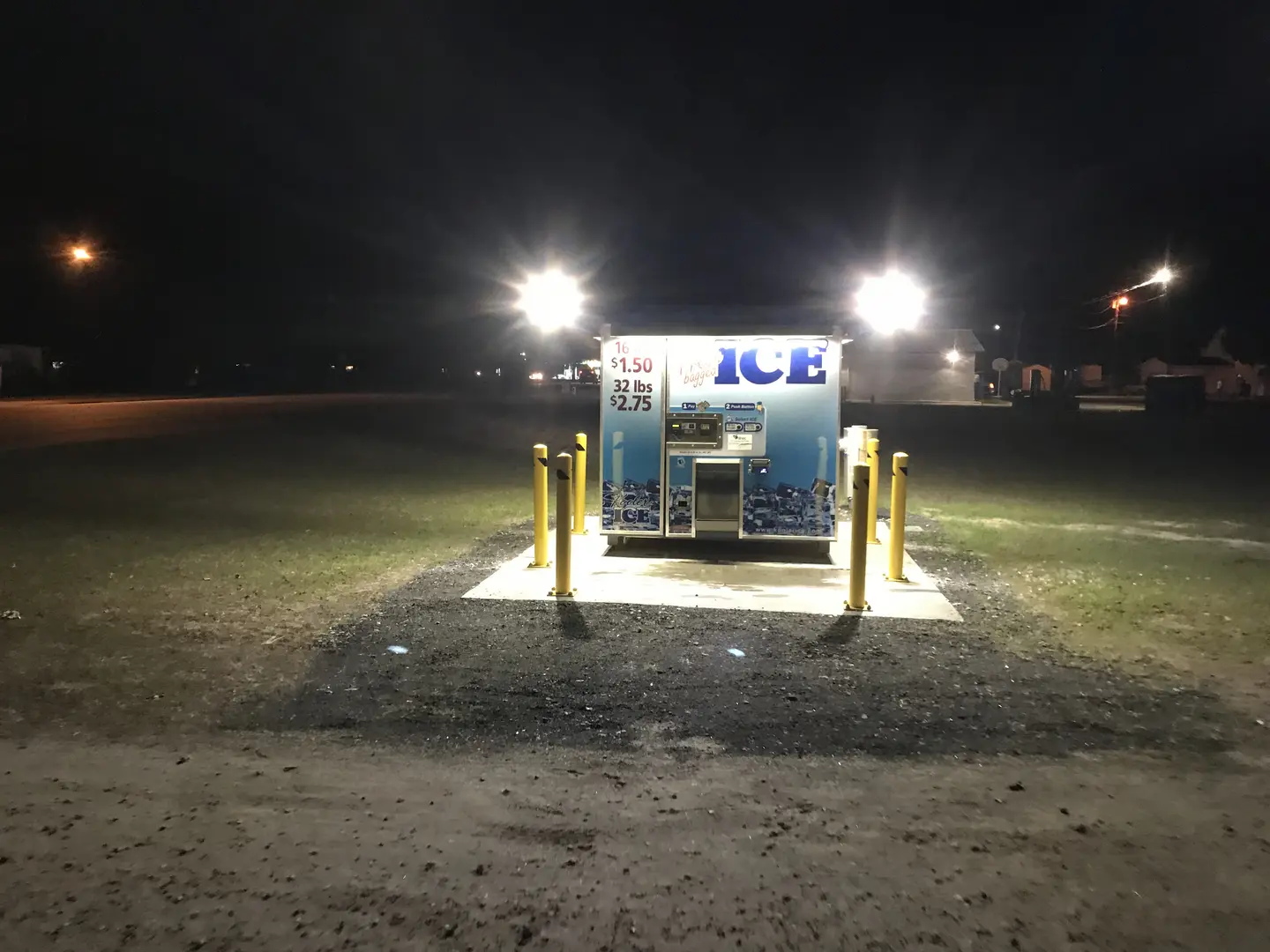 Brightly lit ice dispenser in darkness