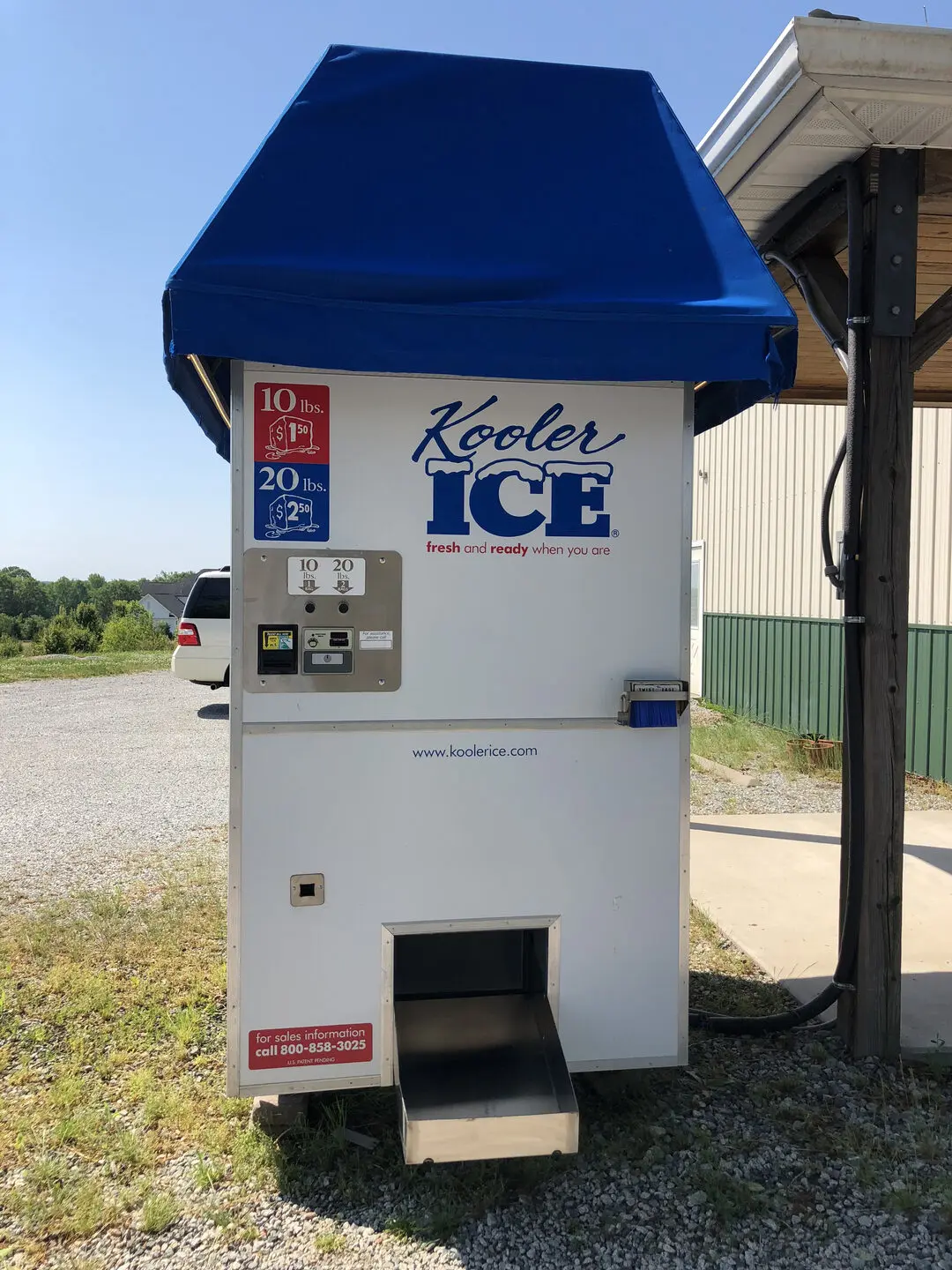 Ice vending machine with blue canopy