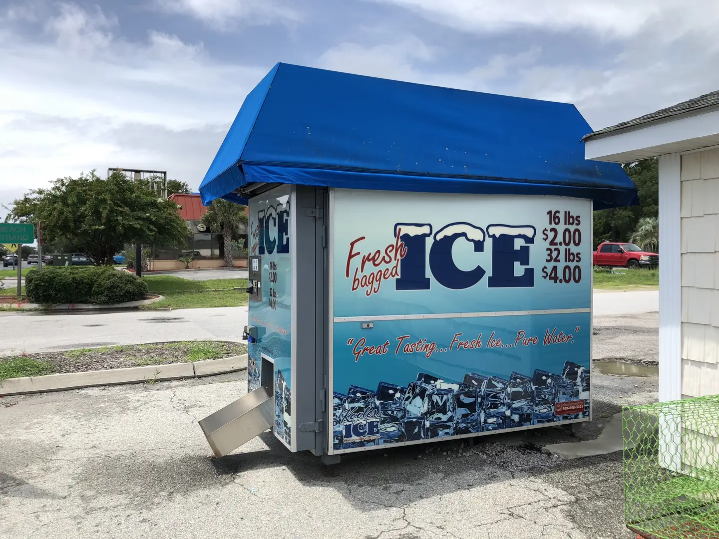 Outdoor ice dispenser with pricing display