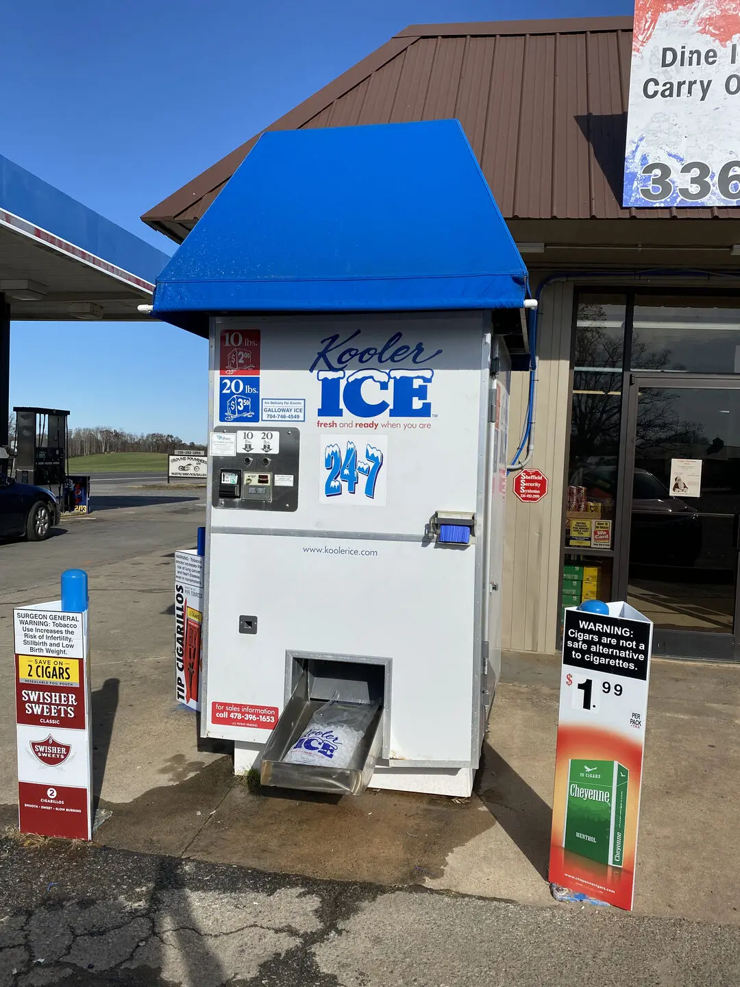 Outdoor ice machine with blue canopy