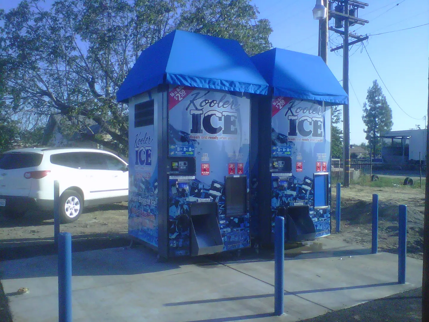 Ice vending machines with blue canopies