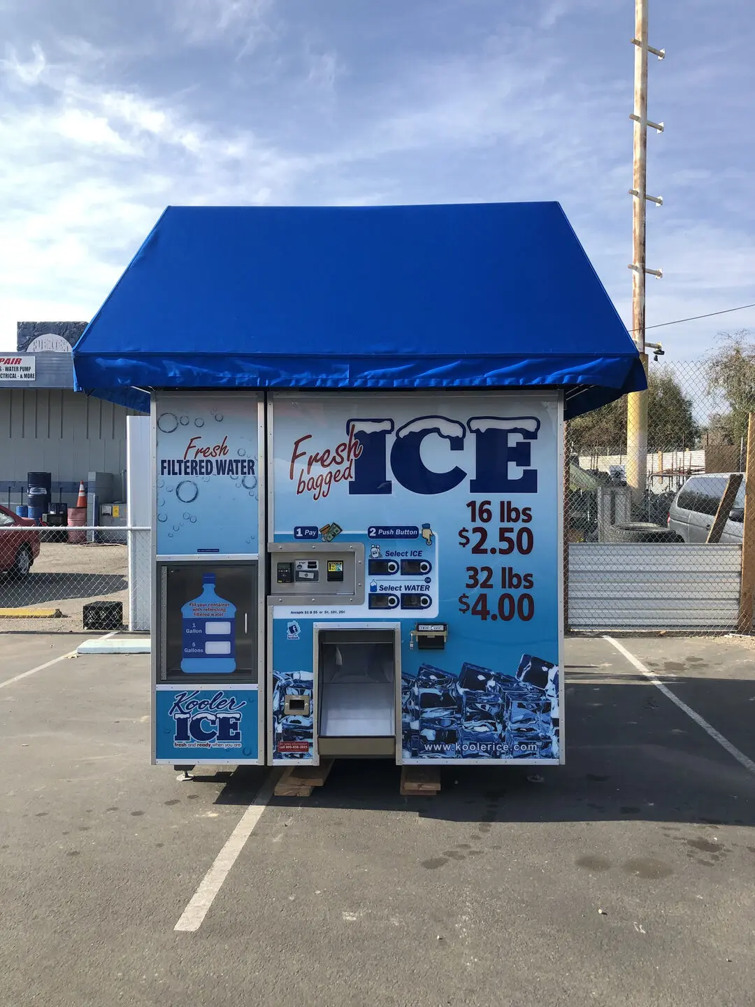 Ice vending machine with blue canopy