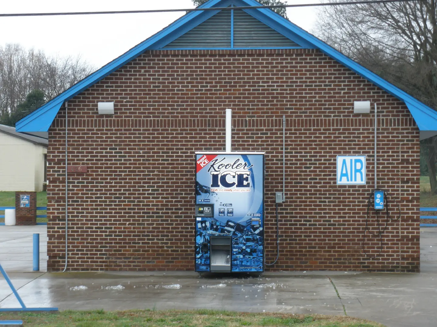Vending machine near air pump sign