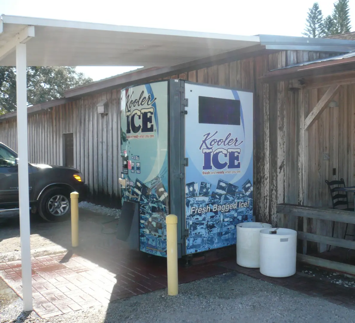 Outdoor ice dispenser by rustic structure
